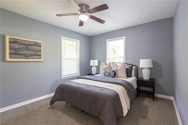3428 College Ave, Kansas City, MO 64128 - bedroom with carpet flooring and a ceiling fan