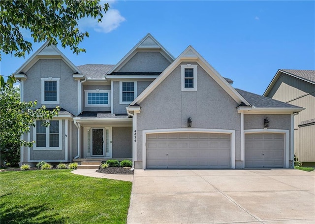4824 W 162nd St, Overland Park, KS 66085 - view of front of home with driveway, a front lawn, stucco siding, and a garage