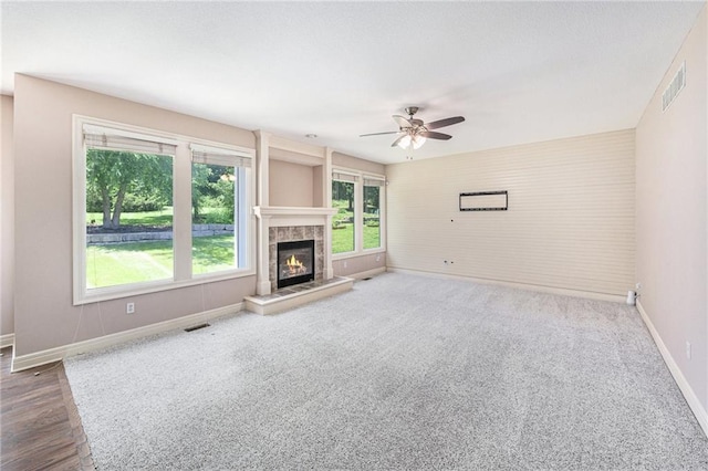 4824 W 162nd St, Overland Park, KS 66085 - unfurnished living room featuring a ceiling fan, a fireplace, and carpet