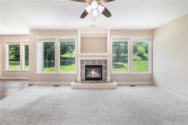 4824 W 162nd St, Overland Park, KS 66085 - unfurnished living room with carpet floors, a tile fireplace, and a ceiling fan