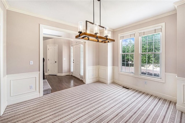 4824 W 162nd St, Overland Park, KS 66085 - unfurnished dining area with a chandelier, wainscoting, ornamental molding, and carpet