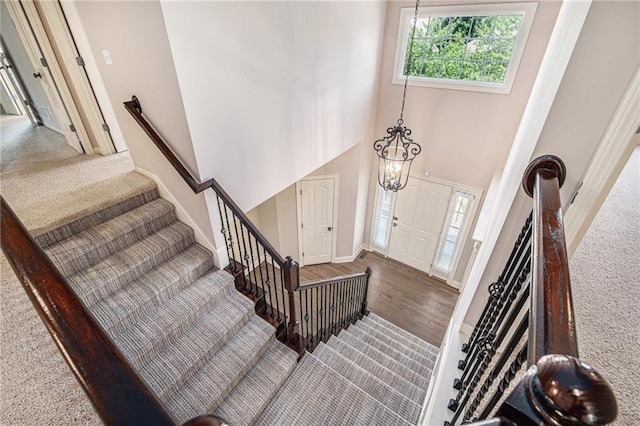 4824 W 162nd St, Overland Park, KS 66085 - entrance foyer with stairs, a towering ceiling, carpet flooring, and a chandelier