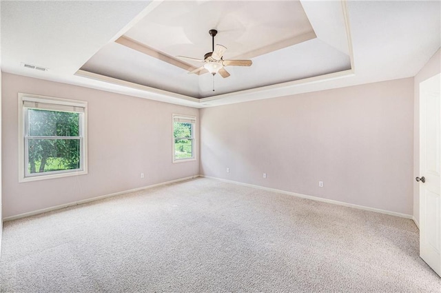 4824 W 162nd St, Overland Park, KS 66085 - unfurnished room featuring a raised ceiling, carpet floors, and a ceiling fan