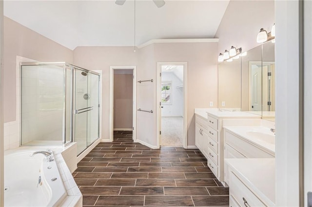 4824 W 162nd St, Overland Park, KS 66085 - bathroom with a shower stall, vanity, a garden tub, wood finish floors, and a ceiling fan