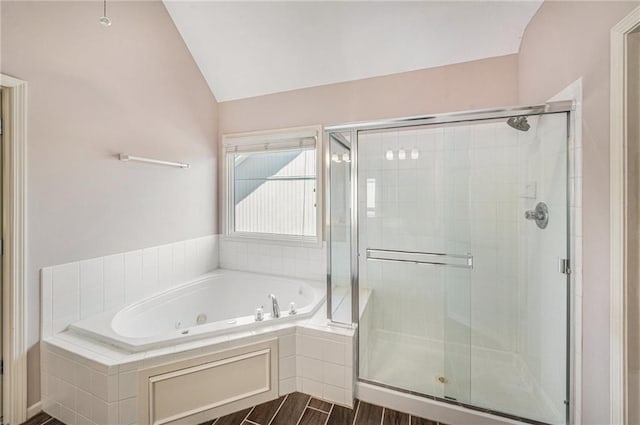 4824 W 162nd St, Overland Park, KS 66085 - bathroom with a stall shower, a tub with jets, lofted ceiling, and wood finished floors