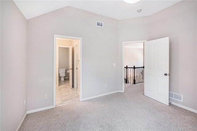 4824 W 162nd St, Overland Park, KS 66085 - unfurnished bedroom with carpet floors, lofted ceiling, and connected bathroom
