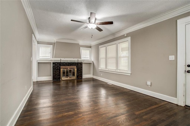4600 Chestnut Ave, Kansas City, MO 64130 - unfurnished living room with a ceiling fan, dark wood finished floors, a textured ceiling, ornamental molding, and a tile fireplace