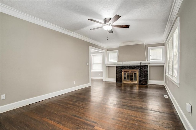 4600 Chestnut Ave, Kansas City, MO 64130 - unfurnished living room with healthy amount of natural light, ceiling fan, dark wood-style flooring, a textured ceiling, and crown molding