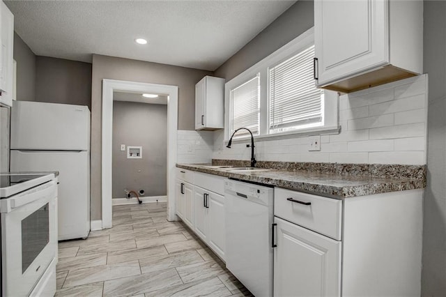 4600 Chestnut Ave, Kansas City, MO 64130 - kitchen featuring white appliances, white cabinets, backsplash, dark countertops, and a textured ceiling