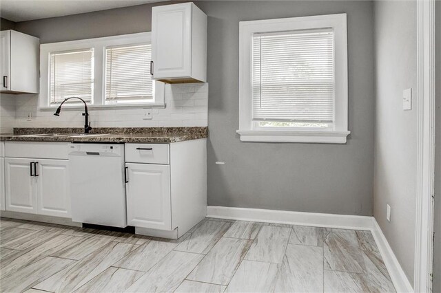 4600 Chestnut Ave, Kansas City, MO 64130 - kitchen with dishwasher, decorative backsplash, and white cabinetry