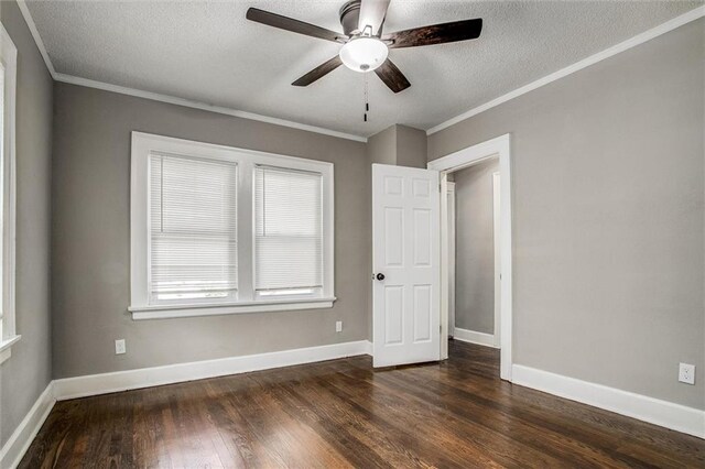 4600 Chestnut Ave, Kansas City, MO 64130 - empty room featuring ornamental molding, dark wood-style flooring, a ceiling fan, and a textured ceiling
