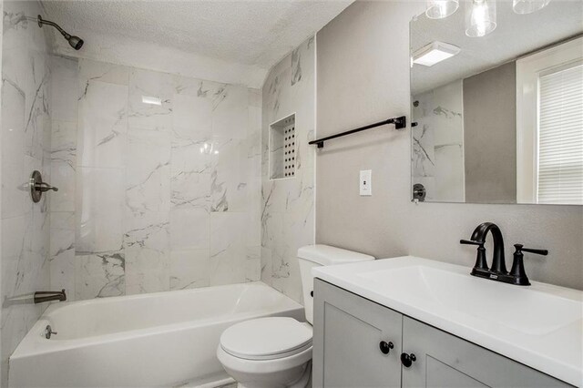 4600 Chestnut Ave, Kansas City, MO 64130 - bathroom with vanity, shower / bathtub combination, and a textured ceiling