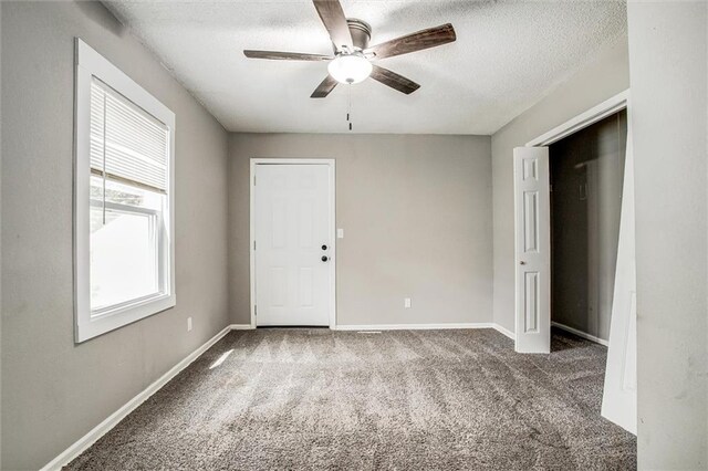 4600 Chestnut Ave, Kansas City, MO 64130 - carpeted empty room featuring a ceiling fan and a textured ceiling