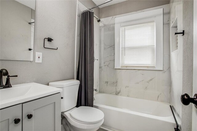 4600 Chestnut Ave, Kansas City, MO 64130 - bathroom with shower / bathtub combination with curtain, vanity, and a textured wall