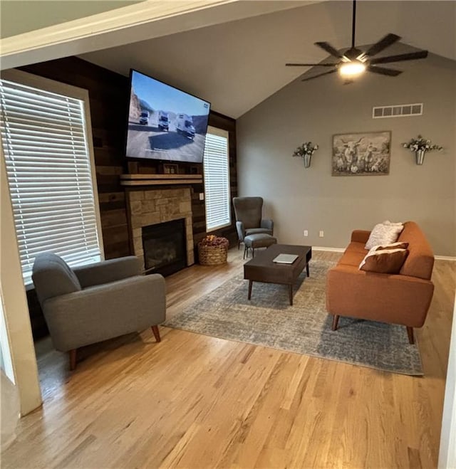 2180 Rock Creek Dr, Tonganoxie, KS 66086 - living room featuring light wood-type flooring, a fireplace, a ceiling fan, and high vaulted ceiling