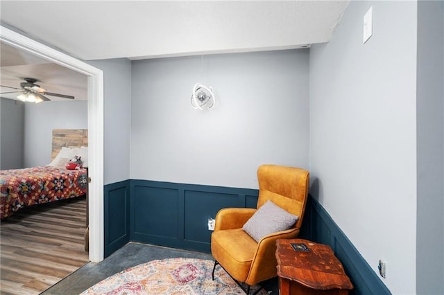 2180 Rock Creek Dr, Tonganoxie, KS 66086 - living area featuring wainscoting, a decorative wall, and ceiling fan