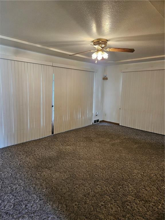 1419 W College Ter, Independence, MO 64050 - carpeted spare room featuring ceiling fan and a textured ceiling