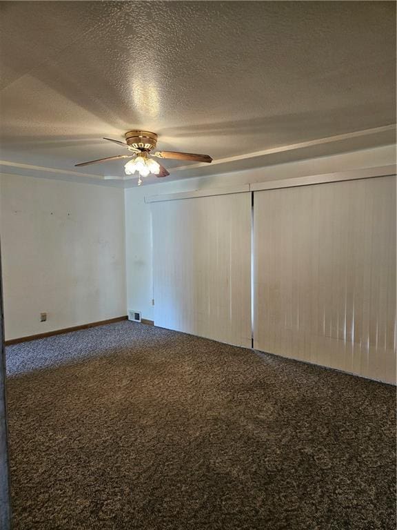 1419 W College Ter, Independence, MO 64050 - unfurnished room featuring carpet floors, a ceiling fan, and a textured ceiling