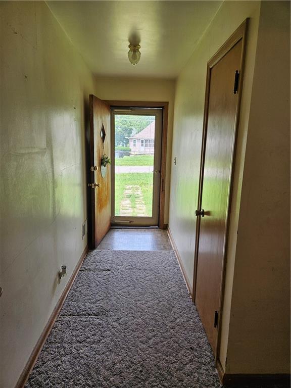 1419 W College Ter, Independence, MO 64050 - hall with baseboards and light carpet