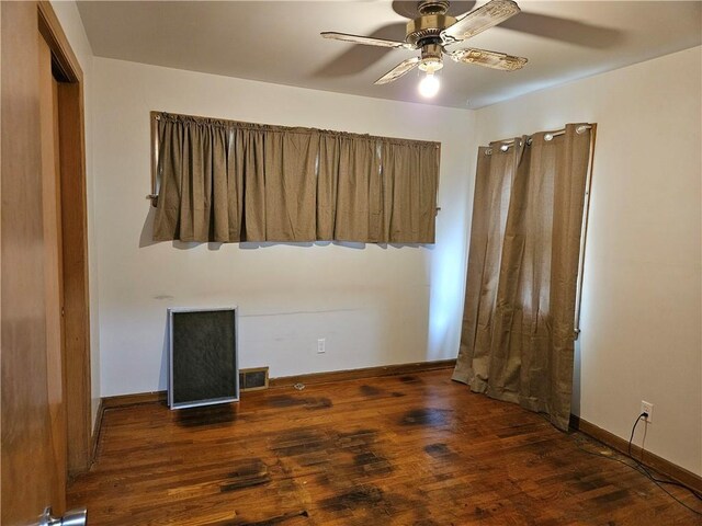 1419 W College Ter, Independence, MO 64050 - unfurnished bedroom with wood finished floors and a ceiling fan