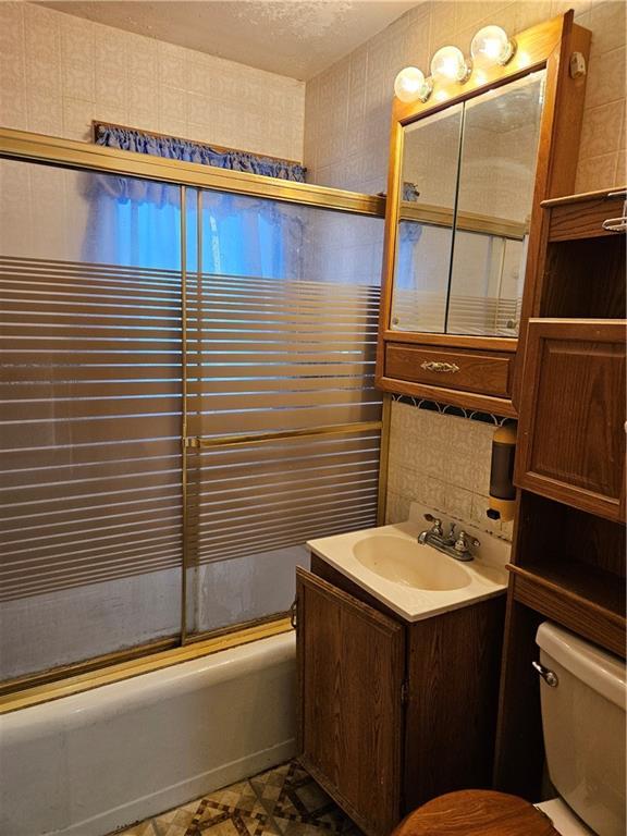 1419 W College Ter, Independence, MO 64050 - bathroom with shower / bathtub combination and vanity