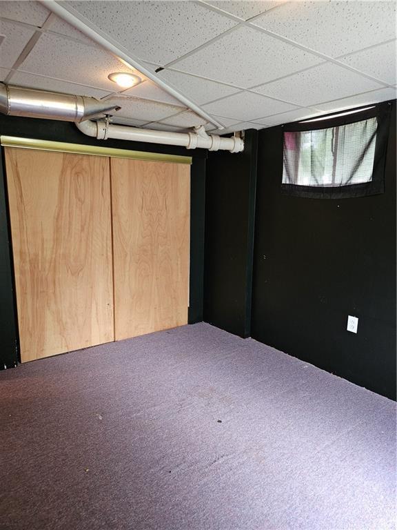 1419 W College Ter, Independence, MO 64050 - below grade area with a drop ceiling and carpet