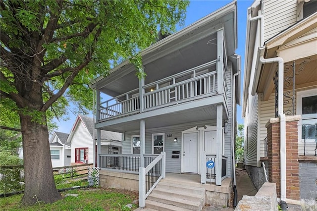 520 Sandusky Ave, Kansas City, KS 66101 - view of property with a balcony and a porch