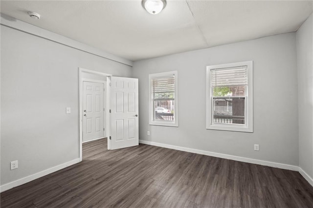 520 Sandusky Ave, Kansas City, KS 66101 - spare room with dark wood-type flooring and a smoke detector