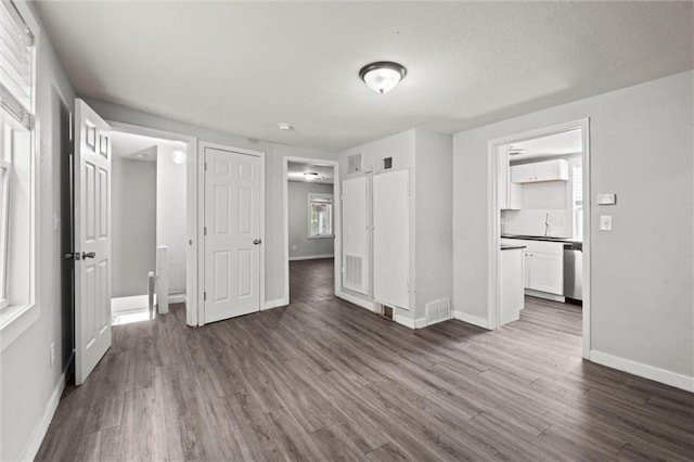520 Sandusky Ave, Kansas City, KS 66101 - unfurnished living room featuring dark wood finished floors