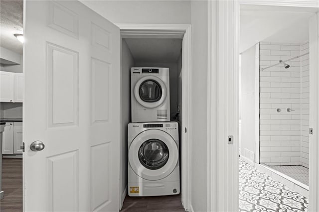 520 Sandusky Ave, Kansas City, KS 66101 - laundry room with stacked washing machine and dryer and dark wood-style floors