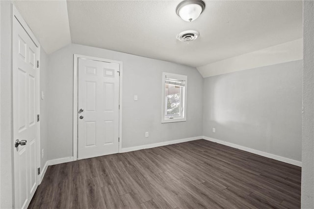 520 Sandusky Ave, Kansas City, KS 66101 - additional living space featuring lofted ceiling and dark wood-style flooring