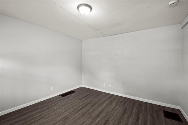 520 Sandusky Ave, Kansas City, KS 66101 - spare room featuring dark wood finished floors and a smoke detector