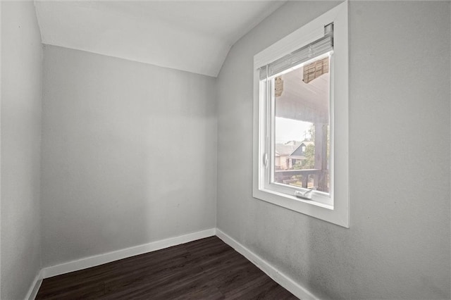 520 Sandusky Ave, Kansas City, KS 66101 - unfurnished room featuring lofted ceiling and dark wood finished floors