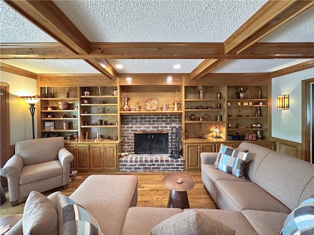 4117 NE Edgewater Ct, Lees Summit, MO 64064 - living room featuring beamed ceiling, wood finished floors, a textured ceiling, a fireplace, and coffered ceiling
