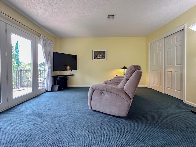 4117 NE Edgewater Ct, Lees Summit, MO 64064 - living area with dark colored carpet and a textured ceiling