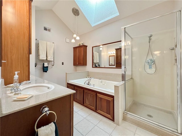 4117 NE Edgewater Ct, Lees Summit, MO 64064 - full bath with a skylight, tile patterned flooring, a shower stall, vanity, and vaulted ceiling