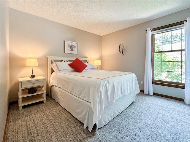 4117 NE Edgewater Ct, Lees Summit, MO 64064 - carpeted bedroom featuring a textured ceiling and baseboards