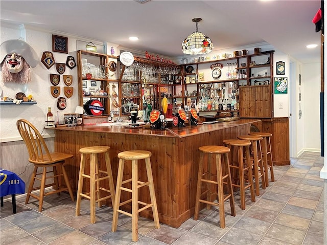 4117 NE Edgewater Ct, Lees Summit, MO 64064 - indoor wet bar with stone finish floors