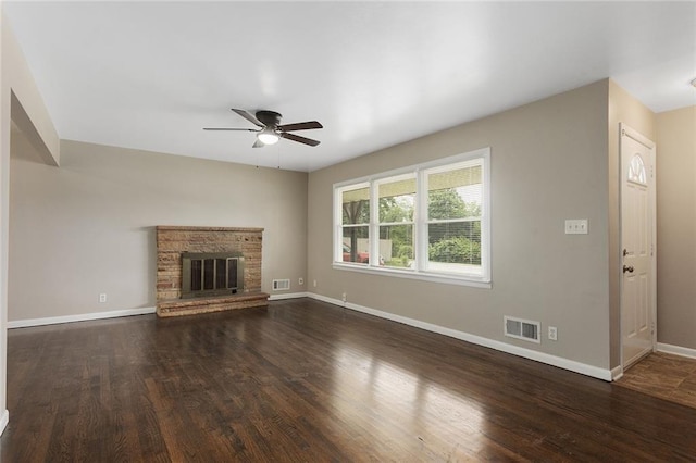 1219 W 35th St, Independence, MO 64055 - unfurnished living room with ceiling fan, wood finished floors, and a glass covered fireplace
