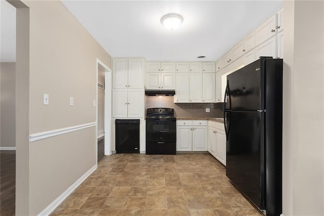 1219 W 35th St, Independence, MO 64055 - kitchen with black appliances, under cabinet range hood, decorative backsplash, white cabinetry, and stone finish flooring