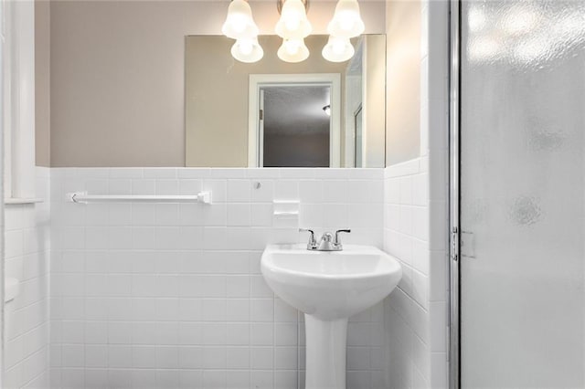 1219 W 35th St, Independence, MO 64055 - bathroom with a stall shower and a chandelier