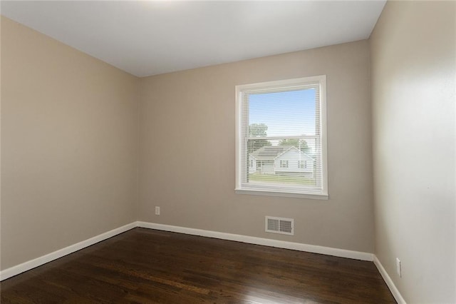 1219 W 35th St, Independence, MO 64055 - spare room featuring dark wood-style flooring