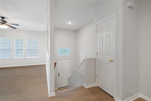 461 S Woodson Ln, Gardner, KS 66030 - entryway with ceiling fan, wood finished floors, recessed lighting, and a textured ceiling