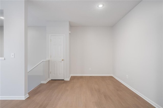 461 S Woodson Ln, Gardner, KS 66030 - empty room with light wood-style floors and baseboards