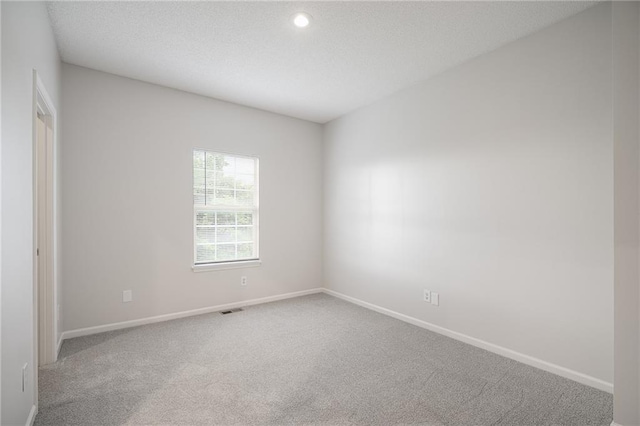461 S Woodson Ln, Gardner, KS 66030 - carpeted empty room with recessed lighting and a textured ceiling