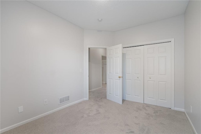 461 S Woodson Ln, Gardner, KS 66030 - unfurnished bedroom featuring carpet floors and a closet