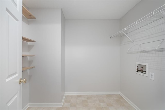461 S Woodson Ln, Gardner, KS 66030 - laundry area featuring hookup for a washing machine and baseboards