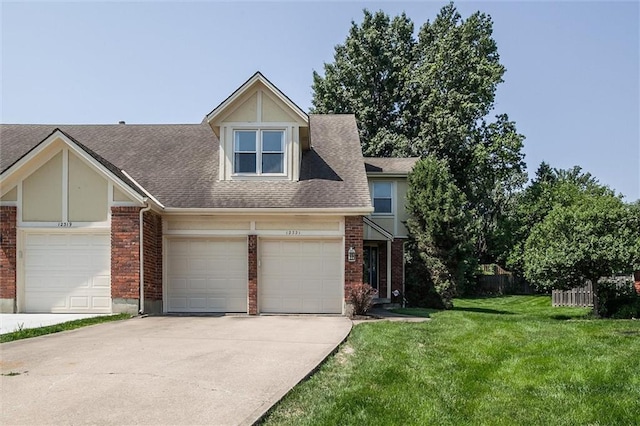 12321 W 105th Ter, Overland Park, KS 66215 - view of front of house featuring concrete driveway, brick siding, a shingled roof, and a garage
