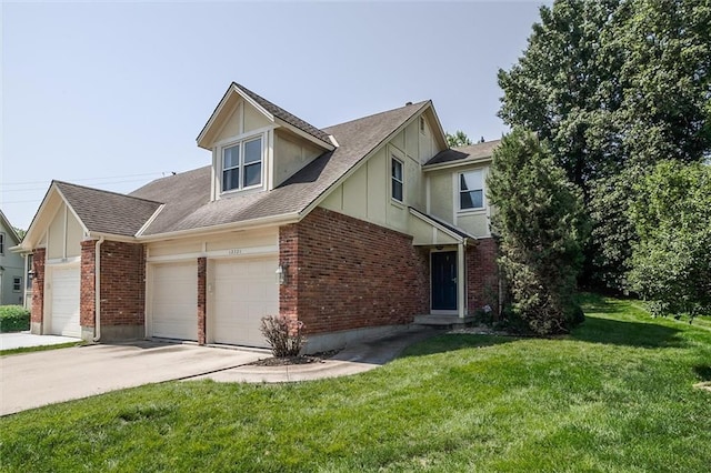 12321 W 105th Ter, Overland Park, KS 66215 - view of front of house with brick siding, a garage, a front yard, driveway, and board and batten siding