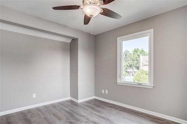 12321 W 105th Ter, Overland Park, KS 66215 - empty room with wood finished floors and a ceiling fan